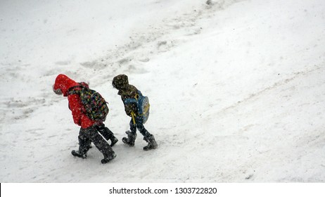 ONTARIO CANADA - JAN 28 2019: School Kids Walking Home With Heavy Snow On The Ground As Major Winter Storm Hit Cities In Ontario