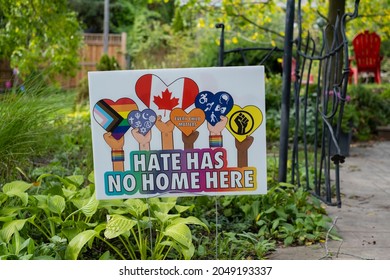 Ontario, Canada - Sep 26 2021: Lawn sign hate has no home here and every child matters with red heart.  Unity, kindness, equality, hope, love, tolerance, anti racism, inclusiveness, unity concept. 