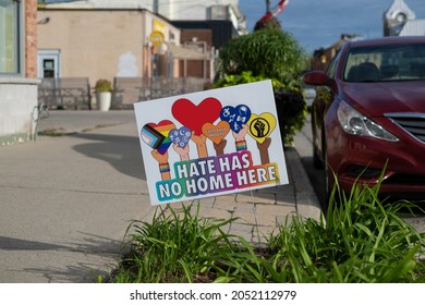 Ontario, Canada - Sep 26 2021: Lawn sign hate has no home here and every child matters with red heart.  Unity, kindness, equality, hope, love, tolerance, anti racism, inclusivness, unity concept. 