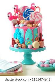 On-trend candyland fantasy drip cake for children's, teen's birthday, anniverary, mother's day and valentine's day celebrations, on white background.