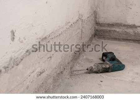 ool of Precision, the Drill Rests on Beton Floor, Awaiting Artistic Craftsmanship to Unfold in Room.