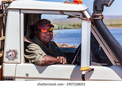 Oombulgurri, WA, Australia - Sep 2, 2014: An Australian Indigenous Community Leader Sits In His Four Wheel Drive Vehicle On The Carson River Track.