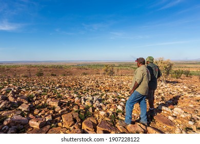 Oombulgurri, WA, Australia - Sep 2, 2014: Two Australian Indigenous Community Leaders Explain Landscape Features To Adventure Travellers On The Carson River Track.