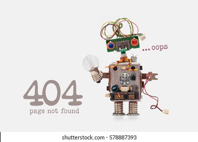 Oops 404 error page not found. Futuristic robot concept with electrical wire hairstyle. Circuits socket chip toy mechanism, funny head, colored eyes, light bulb in hand. beige background. - Shutterstock ID 578887393