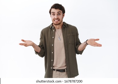 Oops My Bad, Sorry Didnt Know. Awkward Cute Hipster Guy Saying Yikes Shrugging And Throwing Hands Indecisive, Cant Tell, Apologizing Being Guilty, Embarrassed For Silly Mistake, White Background