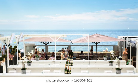 Oostende, Belgium, June 2016 - Interior Detail Of The Bondi Beach Bar In Oostende Beach In A Summer Afternoon With Customers And Tourists.