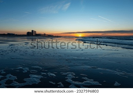 Oostende North Sea beach at sunset, Flanders, Belgium.