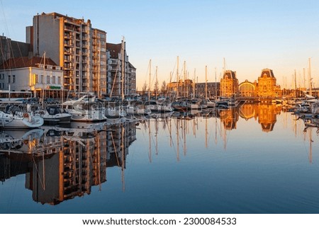 Oostende train station and yacht marina at sunset, Oostende (Ostend), Belgium.