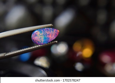 
opal
Is a gem that has beautiful colors
Rare and expensive In the gemstone clamp - Shutterstock ID 1702578247