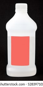 Opaque Plastic Jar Of Rubbing Alcohol With Blank Label. Black Background. Vertical.