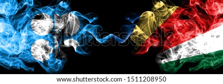 Opec vs Seychelles, Seychelloise abstract smoky mystic flags placed side by side. Thick colored silky smoke flags of Opec and Seychelles, Seychelloise