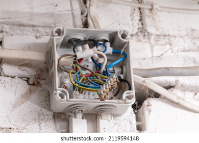Open 6 Way Junction Box. Messy tangled cables. Uncovered open box. - Shutterstock ID 2119594148