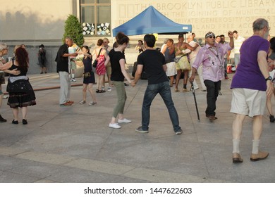 Open Air Free Swing Dance Lessons At Grand Army Plaza By The Library In The Park Slope Section Of Brooklyn On A Very Hot Summer Evening NY July 9 2019