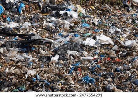 Open air garbage dump. Plastic pollution. Recycling junk. Consumerism
