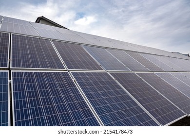 in the open air install environmentally friendly solar panels in the open air. Green electricity concept - Shutterstock ID 2154178473