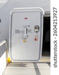 Open aircraft passenger door as seen from the stairs. 