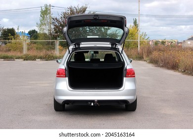 Open back door grey car. Modern car open trunk. Trunk car. 