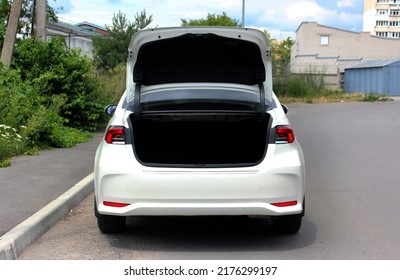 Open Back Door White Modern Car. Modern Car Open Trunk. Trunk Car. Rear View.  