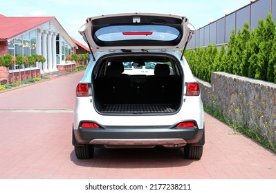 Open Back Door White Modern SUV. Modern SUV Open Trunk. Trunk Car. Rear View.  