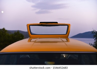 Open Back Trunk Of Taxi Station Wagon Car On Background Sky In Dusk