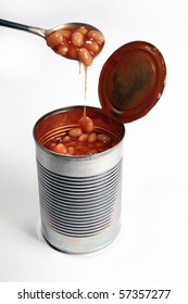 A Open Baked Bean Tin And Spoon Isolated On A White Background.