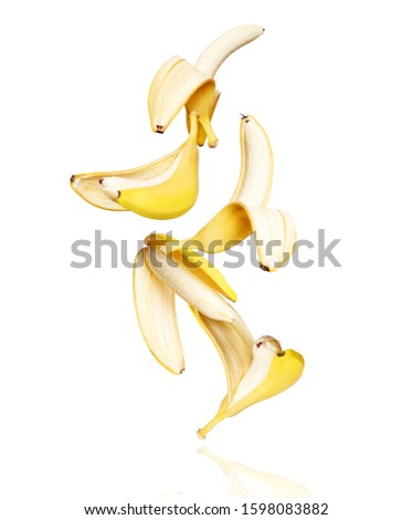 Open bananas fall down isolated on white background