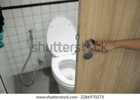 open the bathroom door, go to toilet


