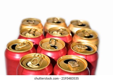 Open Beer Cans On White Background. Recyclable Aluminum Beverage Cans. Used Red Drink Cans After Drinking.