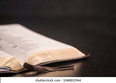 Open Bible on a Slate Tabletop with Customizable Space to Add Text - Shutterstock ID 1048852964