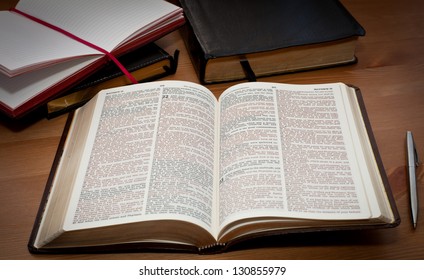 Open Bible On The Wooden Table