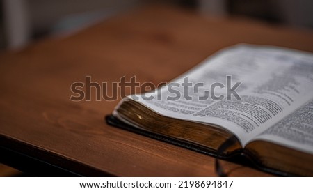 Open Bible with selective focus and space next to it for text