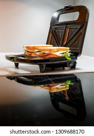 Open Black Sandwich Toaster In Kitchen