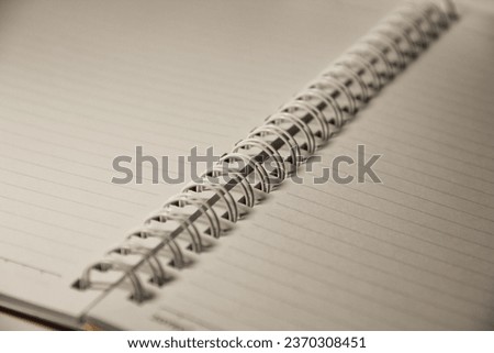 open blank book with spiral ring binding