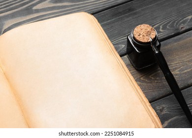 Open blank page book with copy space and ball pen on the wooden table flat lay table background. - Shutterstock ID 2251084915