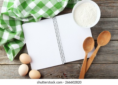 Open blank recipe book on grey wooden background - Shutterstock ID 266602820