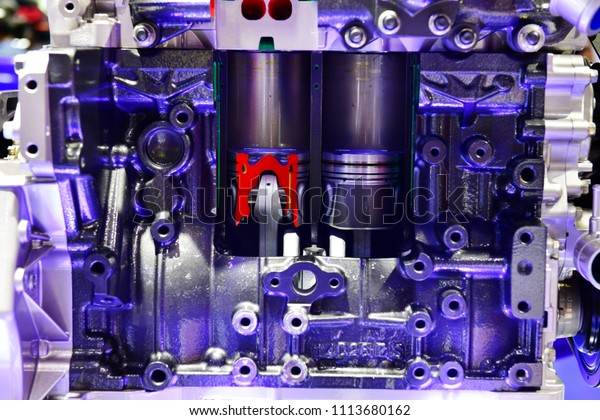 Open block car engine modern powerful\
car engine motor unit - clean and shiny in blue\
tone