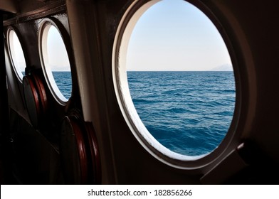 Open Boat Porthole With Ocean View Close Up 