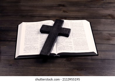 Open book, Bible. Cross of Jesus crucifixion. Prayer. Holy book. Love for Scripture.