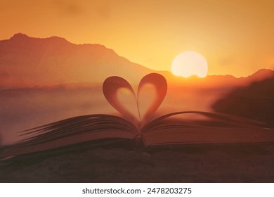 Open book, bible heart at sunset, knowledge, religious belief  - Powered by Shutterstock