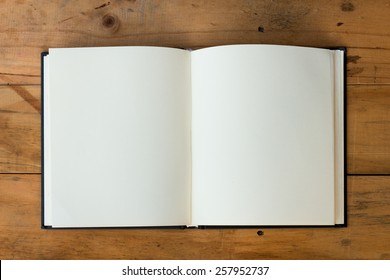 Open Book With Blank Pages On Wood Table