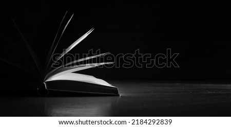 Open book close up,black and white, reading, education, knowledge,home office concept.