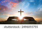 Open book with cross on sunset background. Christian concept. 3D Rendering