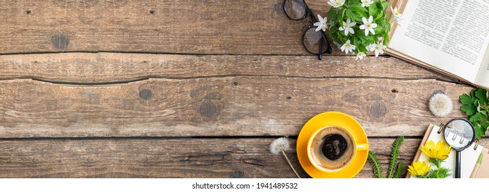 Open book, cup of coffee, bouquet of flowers, pen, notebook, magnifier on old wooden table. Office desk table. Work, studying, educations, reading, botanical concept. Copy space - Powered by Shutterstock