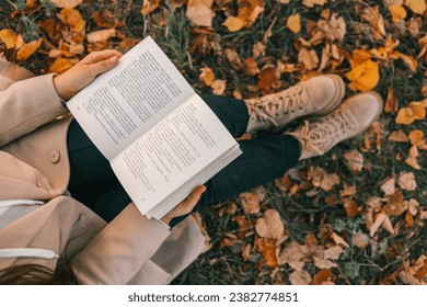 Open book in hands in nature. - Powered by Shutterstock