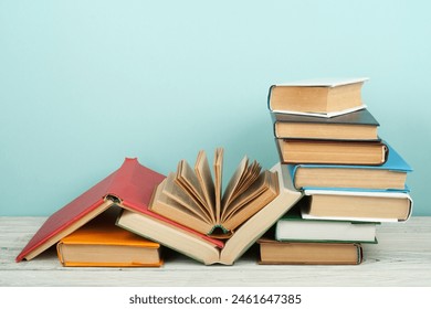 Open book, hardback colorful books on wooden table. Back to school. Copy space for text. Education business concept - Powered by Shutterstock