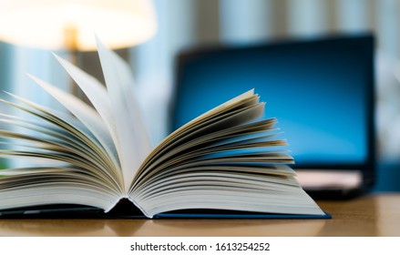 Open book lying on the table in the public library