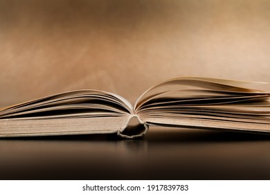 An Open Book Lying On The Table.