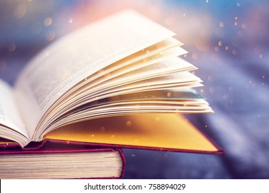 Open Book With Magic Lights. Concept Of Wisdom, Religion, Reading, Imagination, Winter Holidays