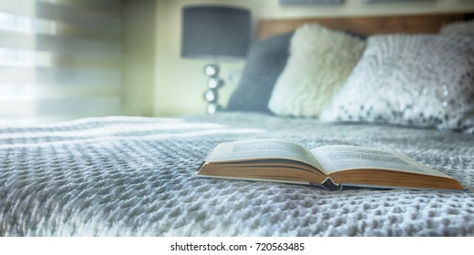 Open book on the bed