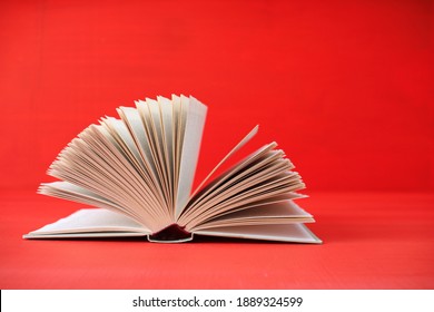 Open Book On Red Background